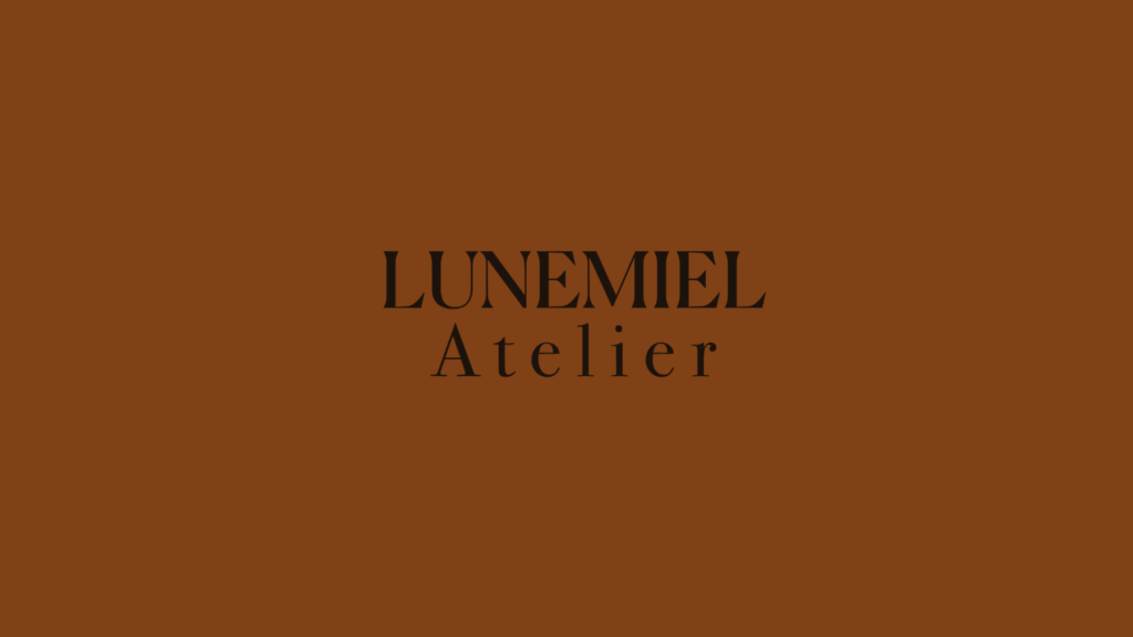 LUNEMIEL Atelier luxury bakery brand logo in black serif typography on a warm caramel brown background.
